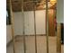 Unfinished basement with exposed framing, concrete walls, and tile flooring awaits personalization at 451 Lansing St, Aurora, CO 80010