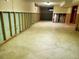 Spacious unfinished basement featuring exposed framing and concrete flooring offers customization at 451 Lansing St, Aurora, CO 80010