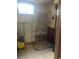 Unfinished bathroom with exposed plumbing, shower stall, and concrete floor awaits renovation at 451 Lansing St, Aurora, CO 80010