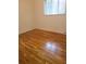 Bright bedroom with hardwood floors and a large window at 451 Lansing St, Aurora, CO 80010