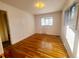This bedroom features hardwood floors, natural light, and neutral-colored walls to give a warm, inviting atmosphere at 451 Lansing St, Aurora, CO 80010