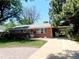 Charming ranch-style home with brick exterior and carport at 451 Lansing St, Aurora, CO 80010