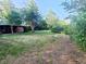 Spacious front yard with mature trees enhancing curb appeal at 451 Lansing St, Aurora, CO 80010
