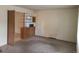 Cozy living room with neutral carpet and shelf feature at 451 Lansing St, Aurora, CO 80010