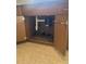 A sink that has the cabinet doors open, exposing the garbage disposal and plumbing at 451 Lansing St, Aurora, CO 80010