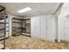 Spacious basement storage area with ample shelving and cabinets at 7447 Quay St, Arvada, CO 80003