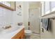 Neat bathroom with shower stall and wood vanity at 7447 Quay St, Arvada, CO 80003