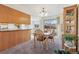 Kitchen and dining area with wood cabinetry and table at 7447 Quay St, Arvada, CO 80003