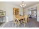 Dining area with wooden table and chairs near entryway at 7447 Quay St, Arvada, CO 80003