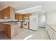 Kitchen features wood cabinets and a breakfast bar at 7447 Quay St, Arvada, CO 80003