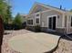 Backyard featuring a concrete patio, rock cover, and an exterior view of the home at 20148 E Dartmouth Dr, Aurora, CO 80013