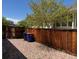 A fenced backyard with rock cover and trees at 20148 E Dartmouth Dr, Aurora, CO 80013