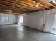 A bright basement with insulated walls and exposed ceiling rafters at 20148 E Dartmouth Dr, Aurora, CO 80013