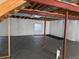 A bright basement with insulated walls and exposed ceiling rafters at 20148 E Dartmouth Dr, Aurora, CO 80013