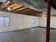 A bright basement with insulated walls and exposed ceiling rafters at 20148 E Dartmouth Dr, Aurora, CO 80013