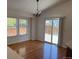 Bright dining area with wood floors, natural light, and convenient access to the outdoor patio at 20148 E Dartmouth Dr, Aurora, CO 80013