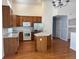 Modern kitchen features an island, stainless steel appliances, and plenty of cabinet storage at 20148 E Dartmouth Dr, Aurora, CO 80013