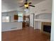 Comfortable living space with wood floors, fireplace, and open design to the kitchen at 20148 E Dartmouth Dr, Aurora, CO 80013