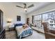 Bedroom featuring plush carpeting, a ceiling fan and a sunny window at 9724 Iris St, Broomfield, CO 80021