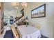 Dining room featuring a table, artwork, and seamless transition into the living area at 9724 Iris St, Broomfield, CO 80021