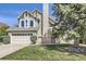 Charming two-story home featuring a two-car garage and well-maintained landscaping at 9724 Iris St, Broomfield, CO 80021