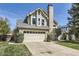 Exterior view of a home showcasing the garage, siding, and well-kept lawn at 9724 Iris St, Broomfield, CO 80021