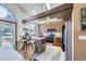 Open kitchen features a breakfast bar, modern appliances, and ample cabinet space at 9724 Iris St, Broomfield, CO 80021
