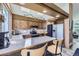 Charming kitchen featuring wood cabinets, stainless steel appliances, and tile countertops at 9724 Iris St, Broomfield, CO 80021