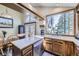 Lovely kitchen featuring a stainless steel dishwasher, and a sunlit window at 9724 Iris St, Broomfield, CO 80021