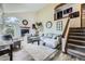 Bright living room featuring a fireplace, large windows, and a comfortable sectional at 9724 Iris St, Broomfield, CO 80021