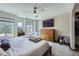 Spacious main bedroom featuring plush carpeting, a ceiling fan and multiple windows at 9724 Iris St, Broomfield, CO 80021