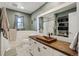 Bathroom featuring decorative sink, modern toilet, and updated shower at 6075 W Jefferson Ave, Denver, CO 80235