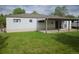 Home exterior featuring a well-maintained lawn and covered back porch area at 3905 Nelson St, Wheat Ridge, CO 80033