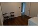 Bedroom with hardwood floors is home to the laundry area at 3905 Nelson St, Wheat Ridge, CO 80033