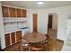Cozy eat-in kitchen features wood cabinets and a retro-style tile floor at 3905 Nelson St, Wheat Ridge, CO 80033