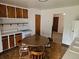 Cozy eat-in kitchen features wood cabinets and a retro-style tile floor at 3905 Nelson St, Wheat Ridge, CO 80033