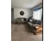 Comfortable living room with neutral carpet, large windows, and ample seating space at 3905 Nelson St, Wheat Ridge, CO 80033