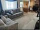 Cozy living room featuring neutral carpet, a fireplace, and comfortable seating at 3905 Nelson St, Wheat Ridge, CO 80033