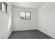 A naturally bright bedroom with gray carpet, a window and closet at 7600 Monaco St, Commerce City, CO 80022