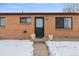 Front entrance of a brick ranch home at 7600 Monaco St, Commerce City, CO 80022