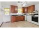 Kitchen with wood cabinets and appliances at 7600 Monaco St, Commerce City, CO 80022