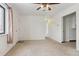 Living room with carpet, ceiling fan, and window at 7600 Monaco St, Commerce City, CO 80022