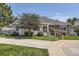 Charming single-story home with brick and siding exterior, landscaped front yard, and walkway at 2265 S Depew St, Denver, CO 80227
