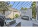 Back patio with seating area featuring patio furniture, lattice screen and landscaped surroundings at 2265 S Depew St, Denver, CO 80227