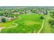 Expansive green park close to homes, with winding walking paths and mature trees for serene outdoor recreation at 12366 Elm Way, Thornton, CO 80241