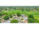 Well-maintained homes in a neighborhood near a park, featuring mature trees, and sidewalks at 12366 Elm Way, Thornton, CO 80241