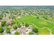 Beautiful aerial view of a residential area with a large green park and walking trails in a quiet neighborhood at 12366 Elm Way, Thornton, CO 80241