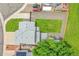 Aerial shot of a home with a well-maintained lawn, long driveway, and backyard surrounded by a wood fence at 12366 Elm Way, Thornton, CO 80241