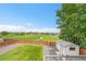 Fenced backyard with a shed offers a private outdoor space with views of a park and mature trees at 12366 Elm Way, Thornton, CO 80241