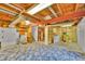 Unfinished basement with exposed beams, utilities, and a large open space for customizable use at 12366 Elm Way, Thornton, CO 80241